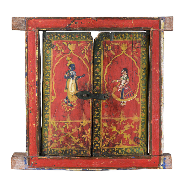 19th-century painted teak window shutter from Rajasthan depicting Radha and blue-skinned Krishna beneath cusped arches with floral borders and original iron latch | Indigo Antiques