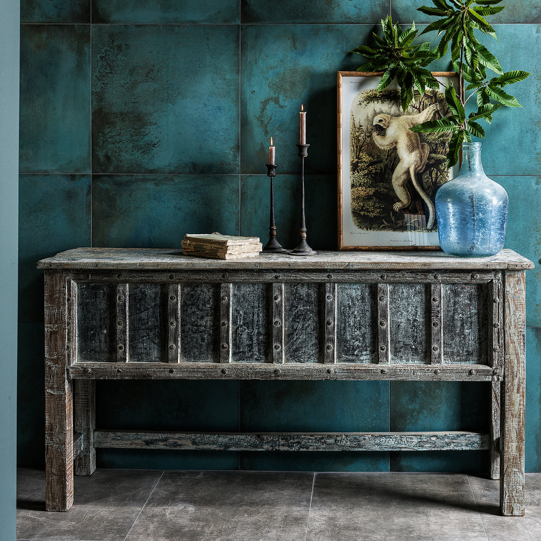 Reclaimed Blue Painted Teak Indian Console Table on a tiled background by Ca Pietra