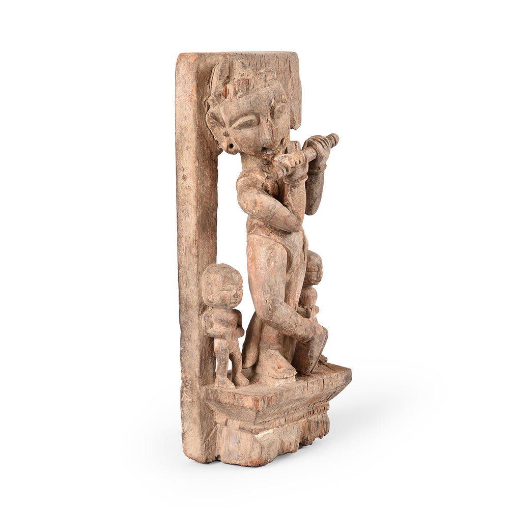 Angled View Of Antique Carved Figurine Of Krishna Playing The Flute | INDIGO ANTIQUES
