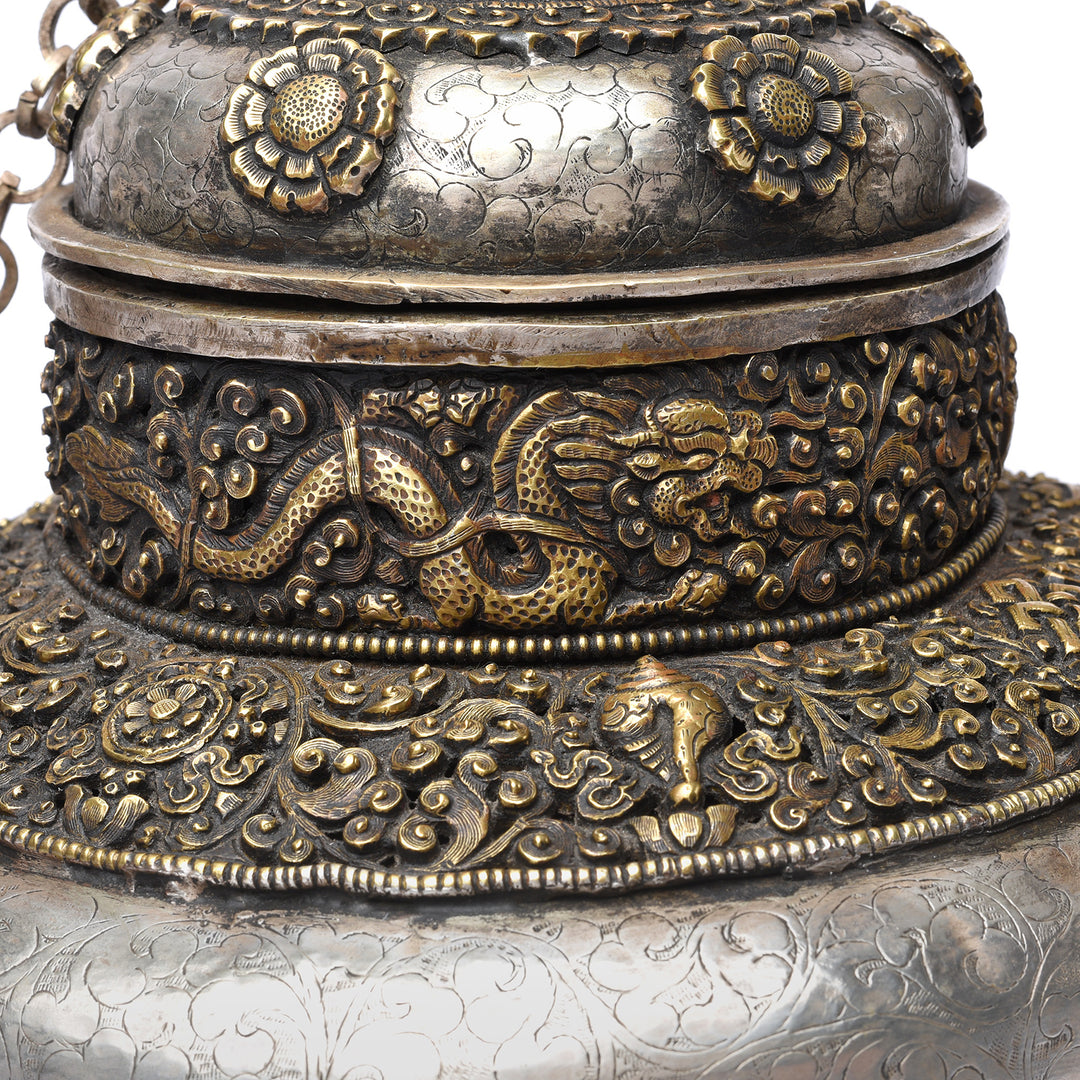 Dragin & Tibetan symbol detail on a Vintage Silver Plated Tibetan Teapot deorated with dragons & makara | Indigo Antiques
