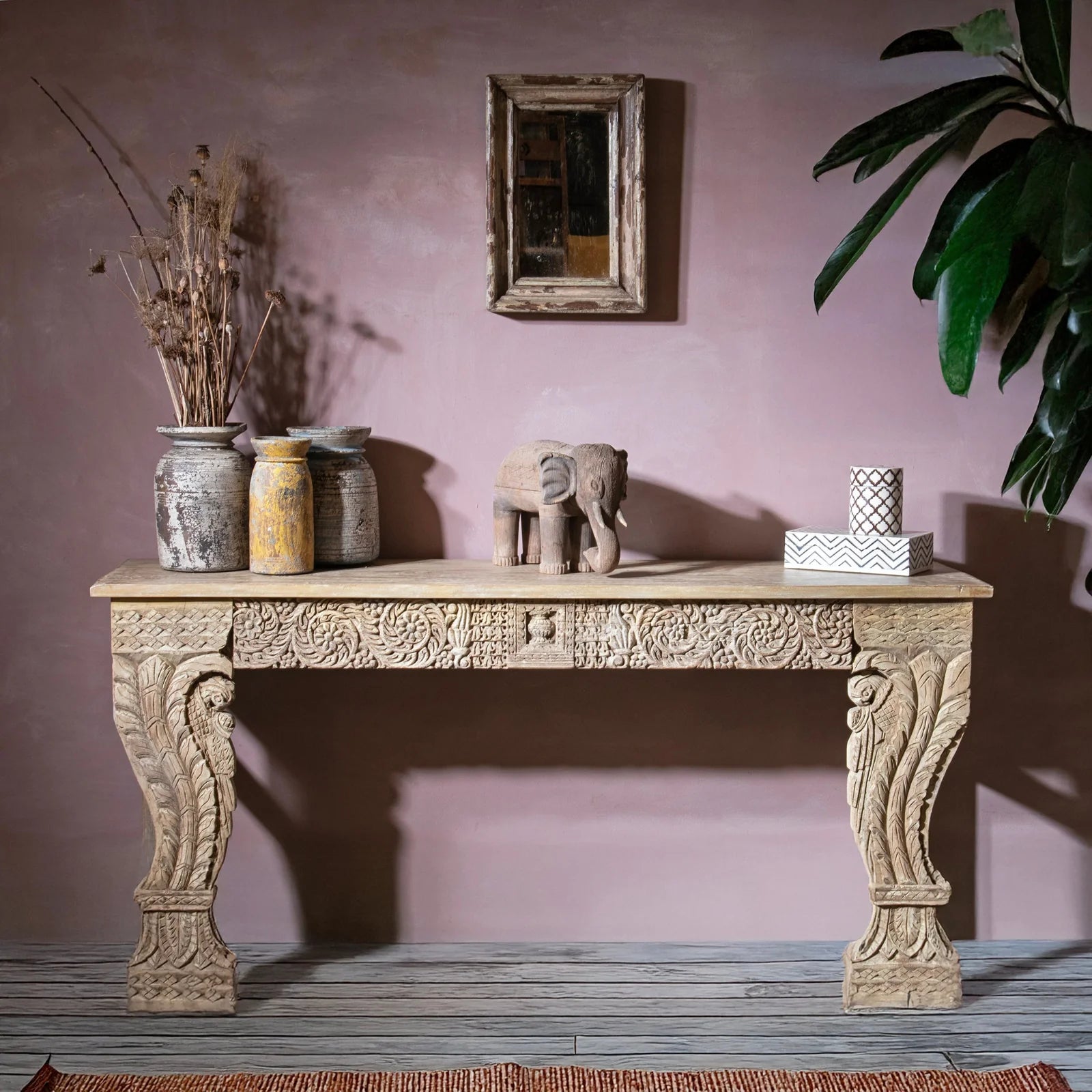 Carved antique Indian sideboard with dusty pink wall