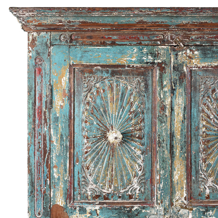Corner Detail From Antique Green Painted Carved Almirah Cabinet With Sunburst Panels | Indigo Antiques