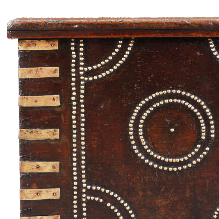 Brass corner detail from an Antique Indian Brass Studded Bombay Rosewood Chest | Indigo Antiques
