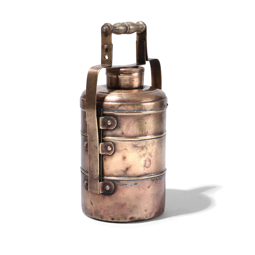 Angled View Of Antique Three Tier Brass Indian Tiffin Box Dabba With Handle And Inscriptions Circa 1900