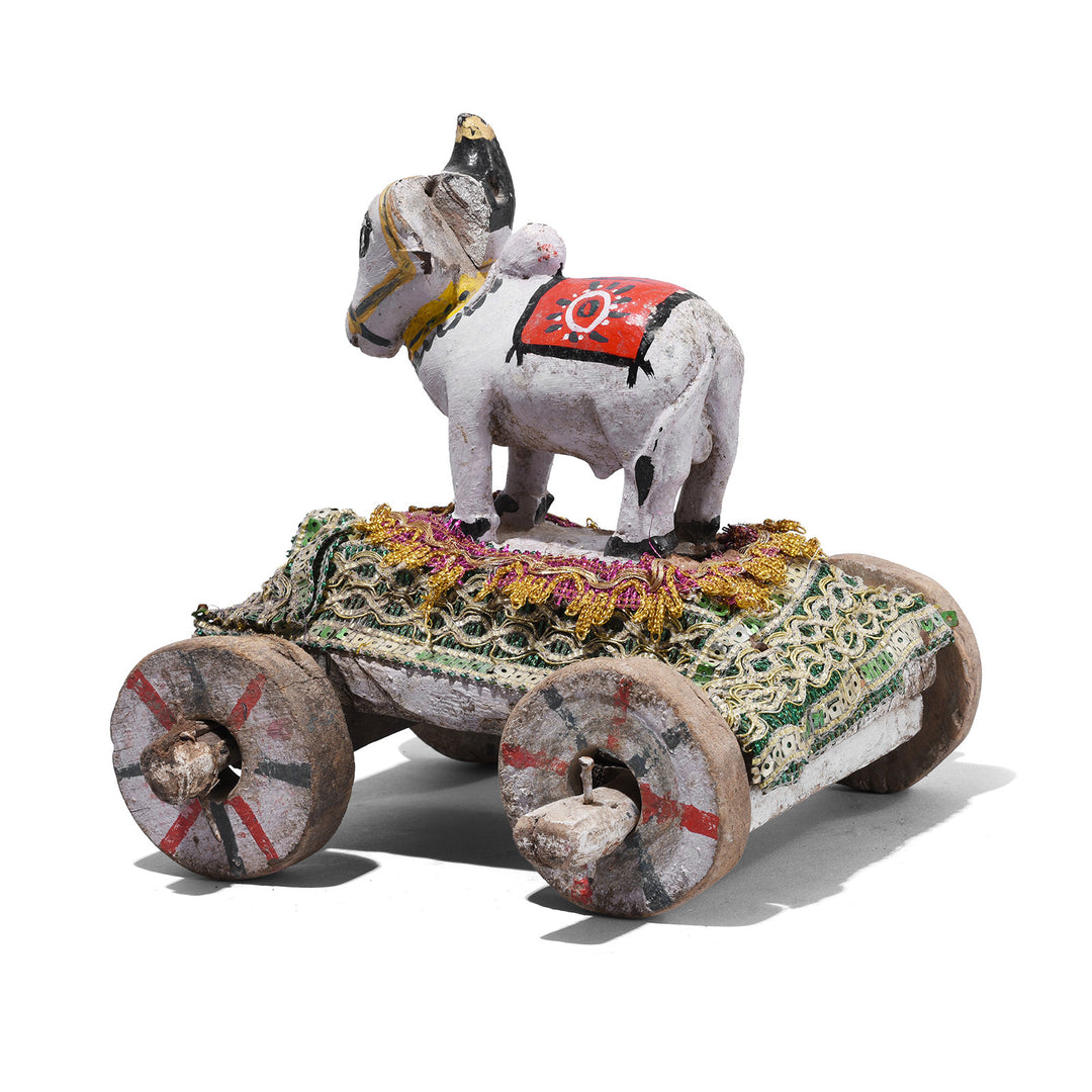 Rear View Of Antique Indian Carved Teak Nandi Bull Toy On Wooden Wheeled Cart From Rajasthan