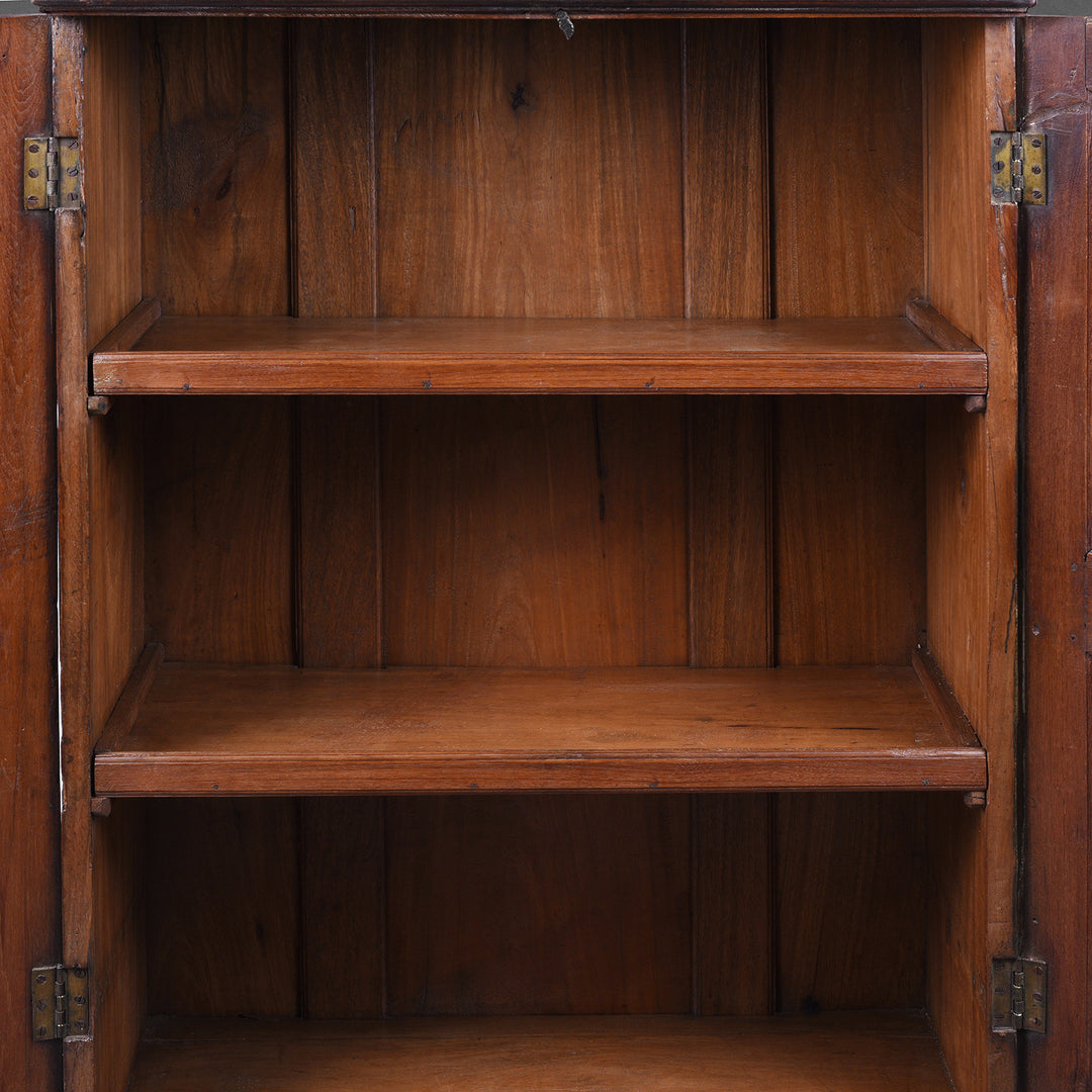Interior Of Antique Indian Teak Almirah Cabinet With Hand Carved Sunburst Panels And Rich Aged Patina