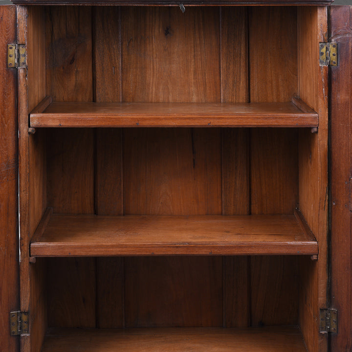 Interior Of Antique Indian Teak Almirah Cabinet With Hand Carved Sunburst Panels And Rich Aged Patina
