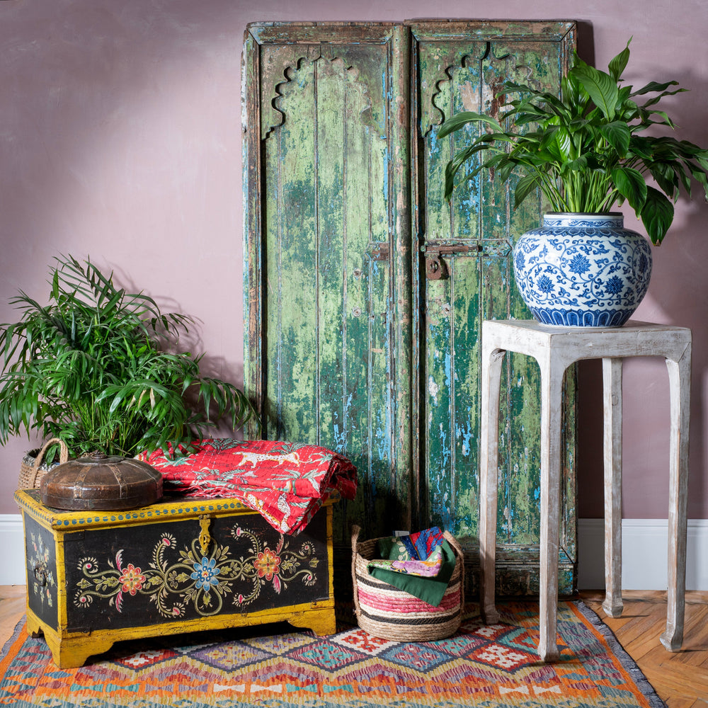 Rustic antique Indian bold & bohemian interior with a vintage Indian painted chest & Chinese porcelain