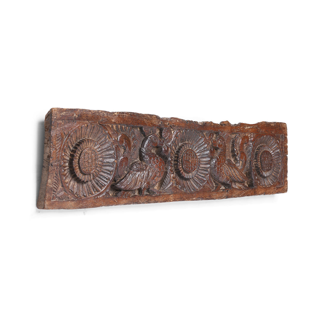 Angled View Of Hand Carved Antique Indian Lintel Panel With Stylised Floral Rosettes And Mythical Bird Motifs