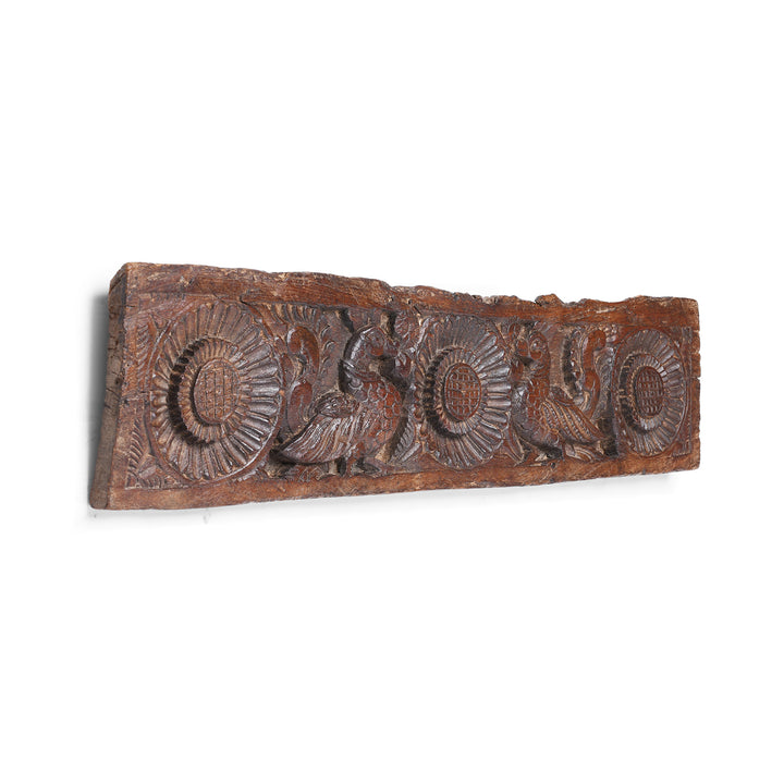 Angled View Of Hand Carved Antique Indian Lintel Panel With Stylised Floral Rosettes And Mythical Bird Motifs