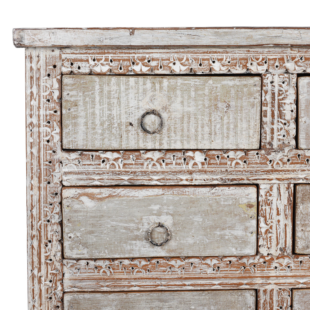 Corner Detail From Reclaimed Teak Chest Of Drawers With Ten Drawers And Hand Carved Detailing In Distressed White Finish | Indigo Antiques