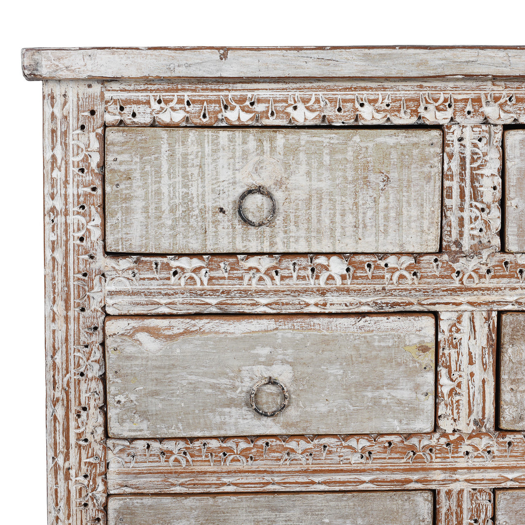 Corner Detail From Reclaimed Teak Chest Of Drawers With Ten Drawers And Hand Carved Detailing In Distressed White Finish | Indigo Antiques