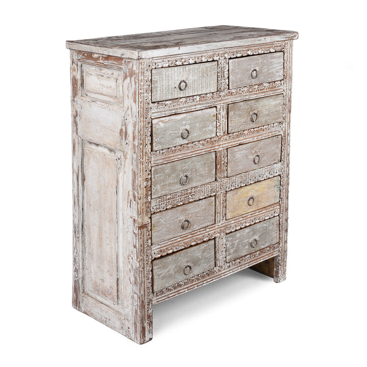 Angled VIew Of Reclaimed Teak Chest Of Drawers With Ten Drawers And Hand Carved Detailing In Distressed White Finish | Indigo Antiques