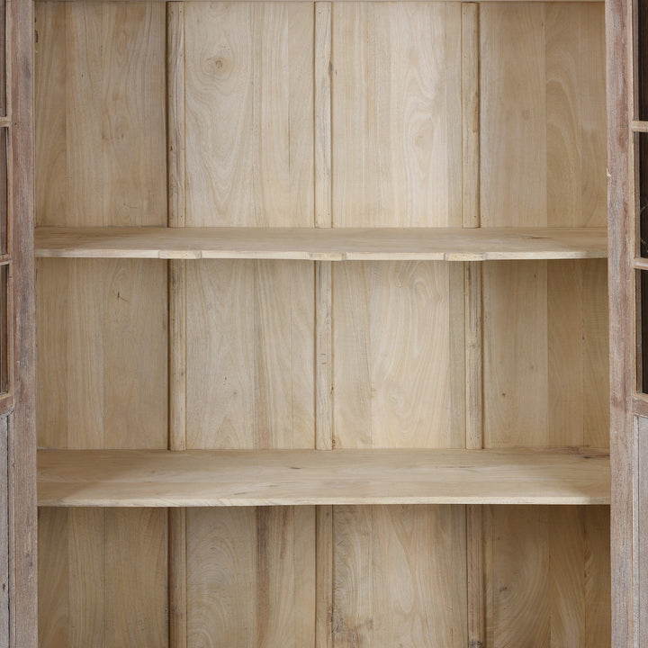 Interior Detail From Reclaimed Teak Glazed Cabinet With Four Glass Doors And Internal Shelving