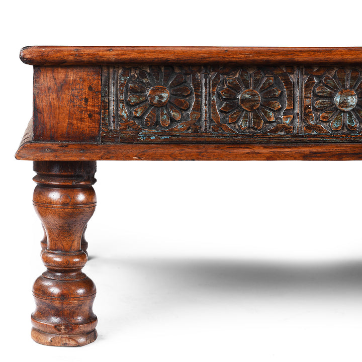 Leg And Carving Detail From Reclaimed Wood Coffee Table With Carved Floral Panels And Turned Legs