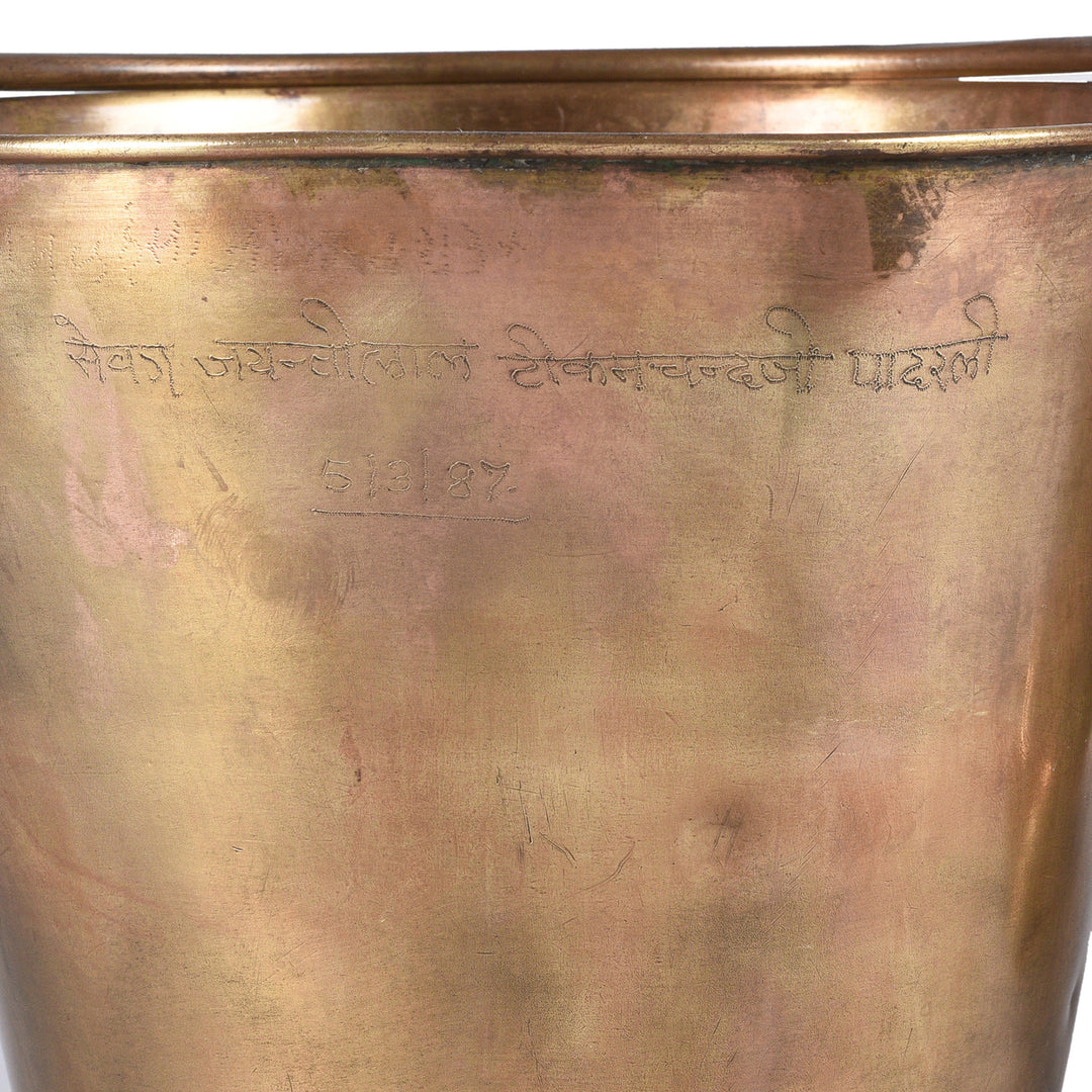 Engraving Detail From Indian Brass bucket with handle on a white background