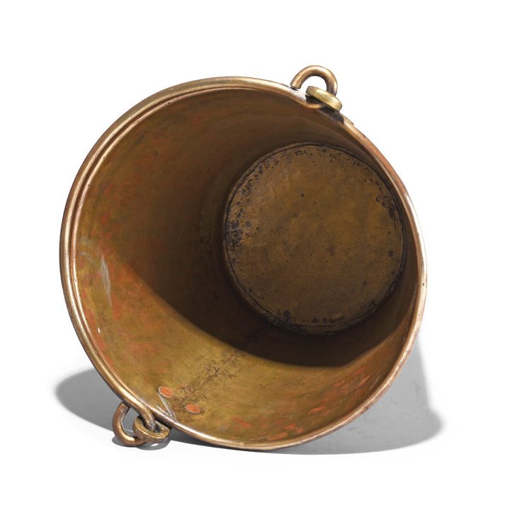 Brass bucket with a handle on a white background