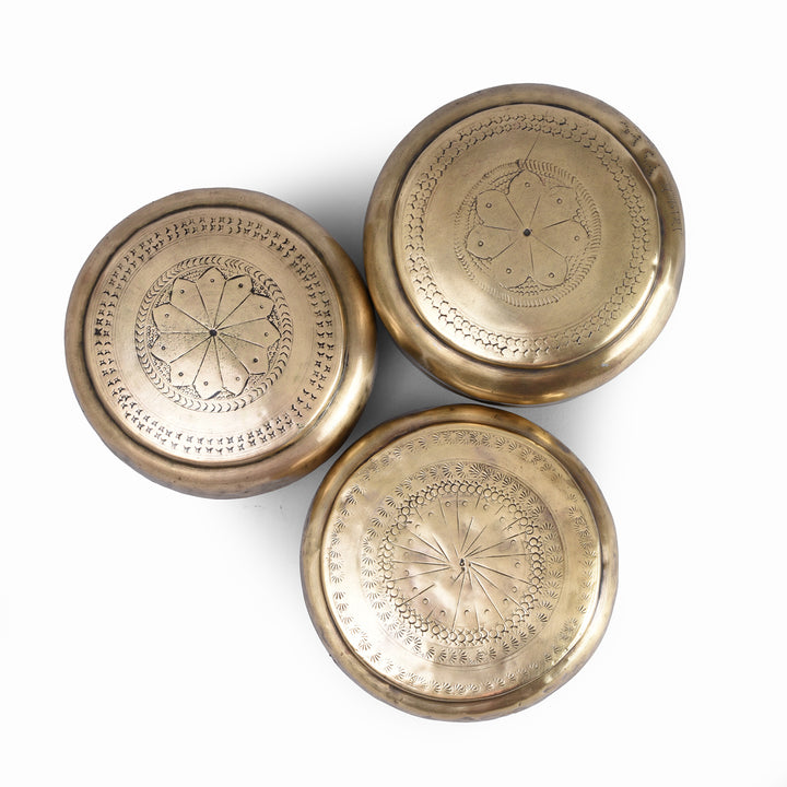 Top Down View Of Set Of Antique Brass Paan Boxes From India With Engraved Lids Circa 1920