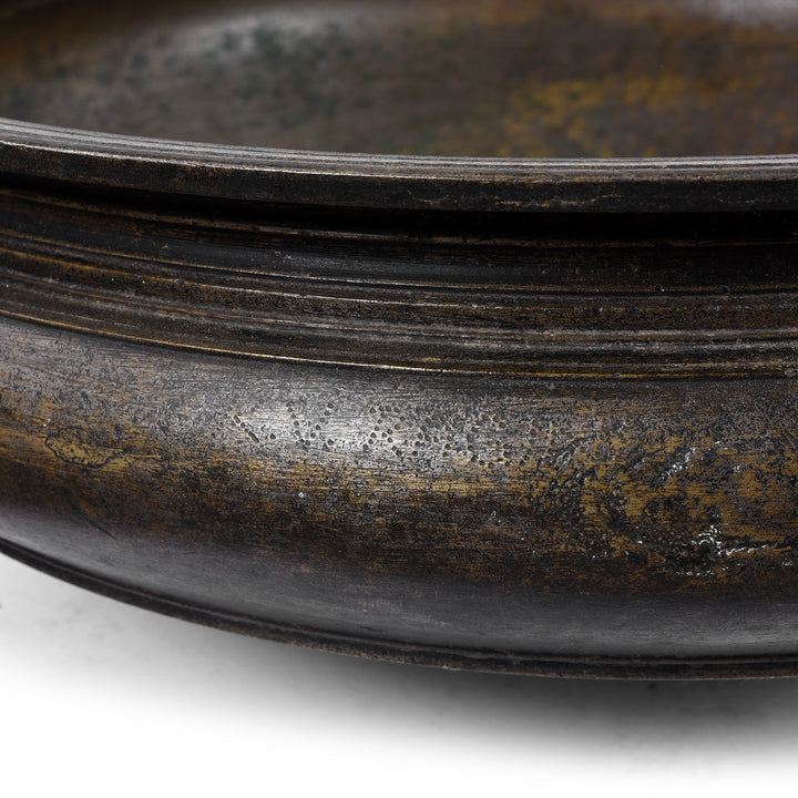 Etching on bronze urli Indian bowl