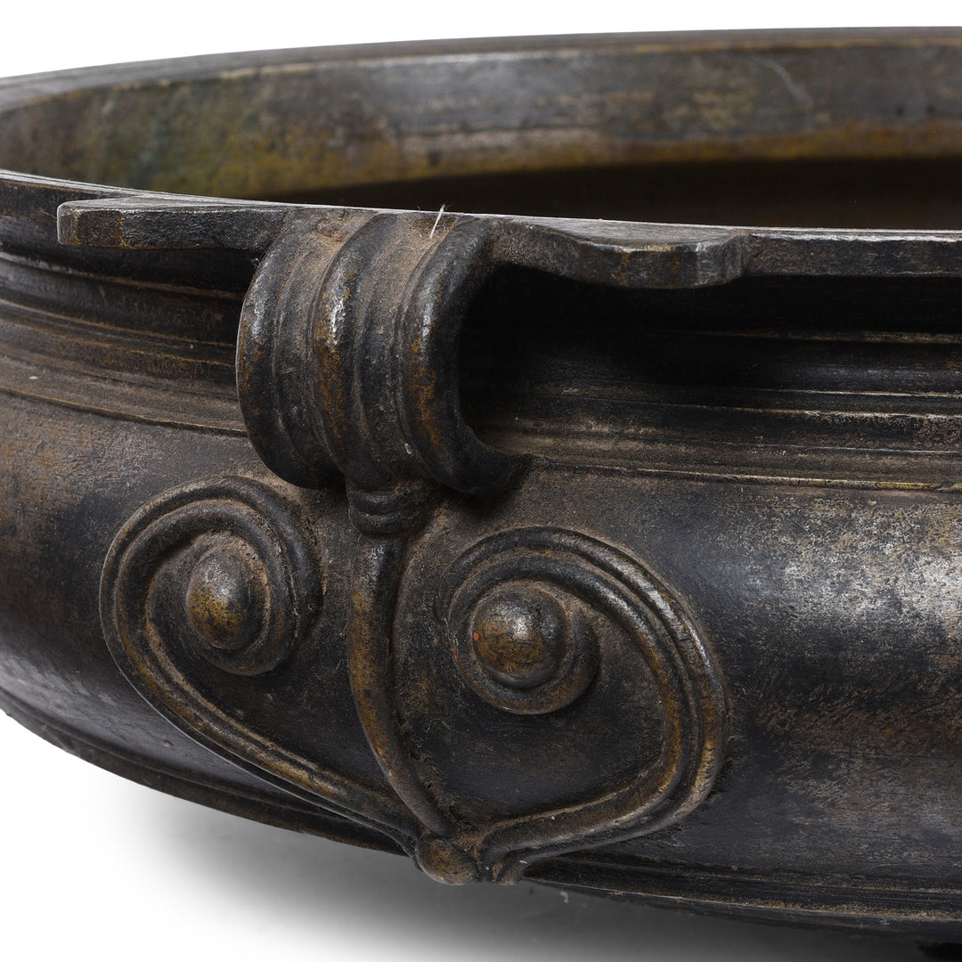 Stylised yoni on antique bronze urli from South India