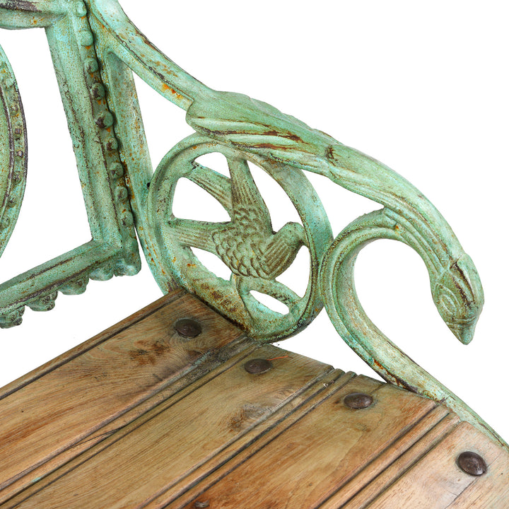 Bird Detail From Arm Of Reproduction cast iron garden seat with dog motif €“ heavy€‘duty vintage-style outdoor seat featuring detailed dog-shaped design and slatted timber seat 