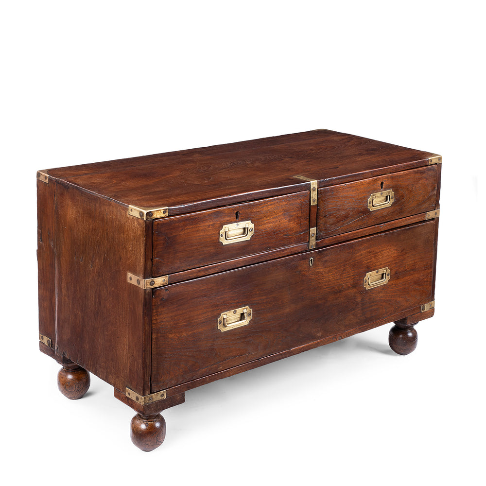 Angled View Of Brass Bound Teak Anglo Indian Military Campaign Chest Of Drawers With Recessed Brass Handles And Bun Feet