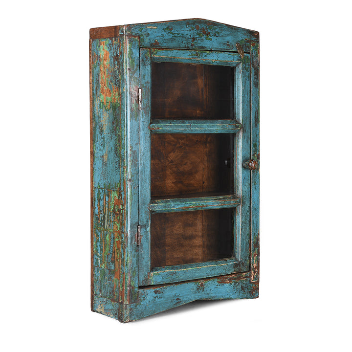 Angled View Of Blue Painted Teak Glazed Wall Cabinet Circa 1930 With Distressed Patina