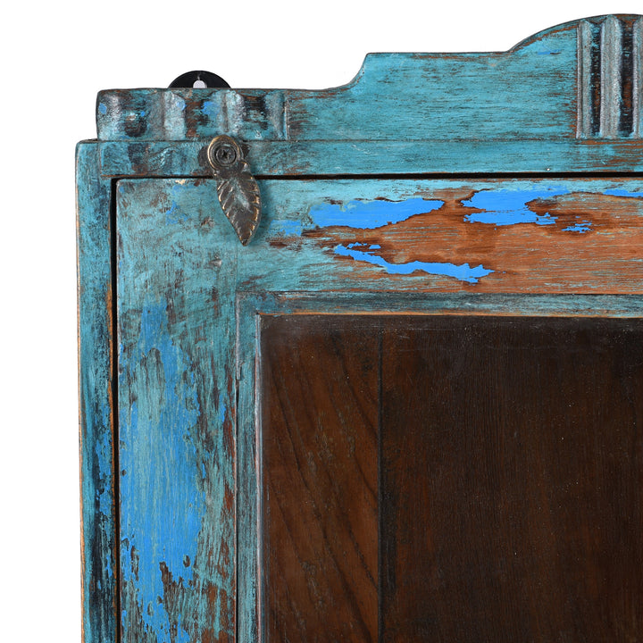 Corner Detail From Antique Blue Painted Teak Wall Cabinet With Glass Door And Shelf