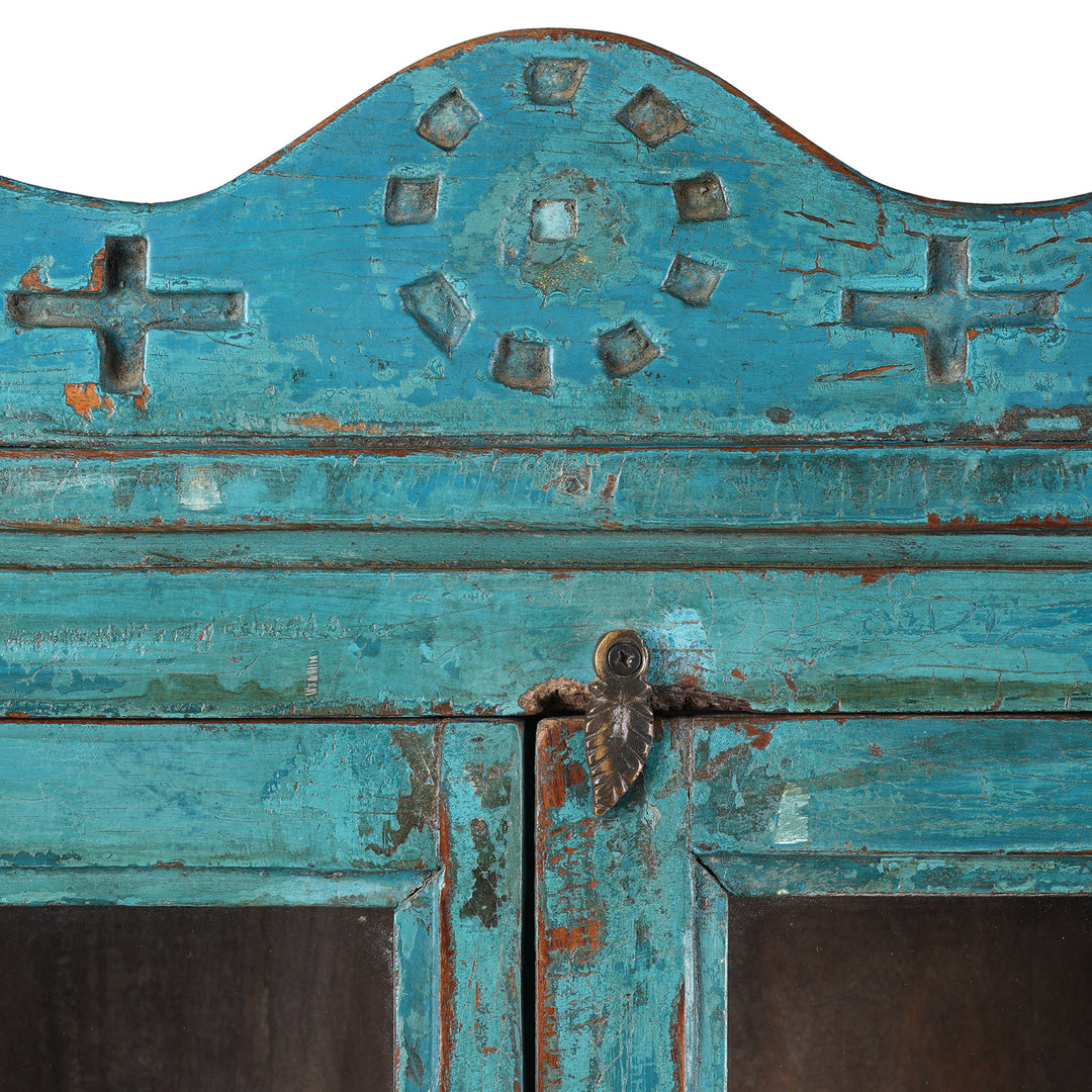 Paintwork And Patina Detail From Blue Painted Teak Glazed Wall Cabinet Circa 1930 With Double Doors And Decorative Crest
