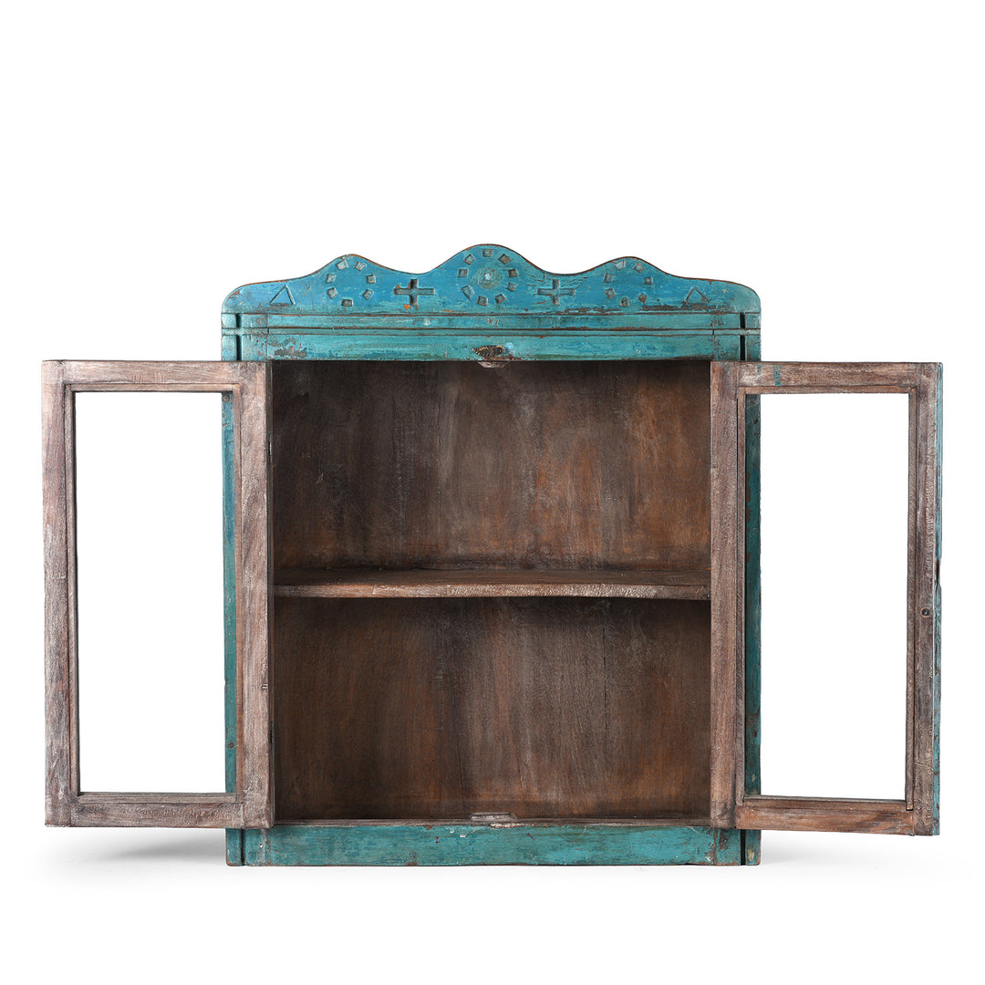 Interior View Of Shelf From Blue Painted Teak Glazed Wall Cabinet Circa 1930 With Double Doors And Decorative Crest