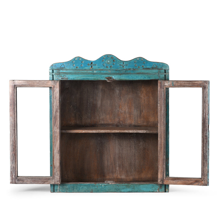 Interior View Of Shelf From Blue Painted Teak Glazed Wall Cabinet Circa 1930 With Double Doors And Decorative Crest