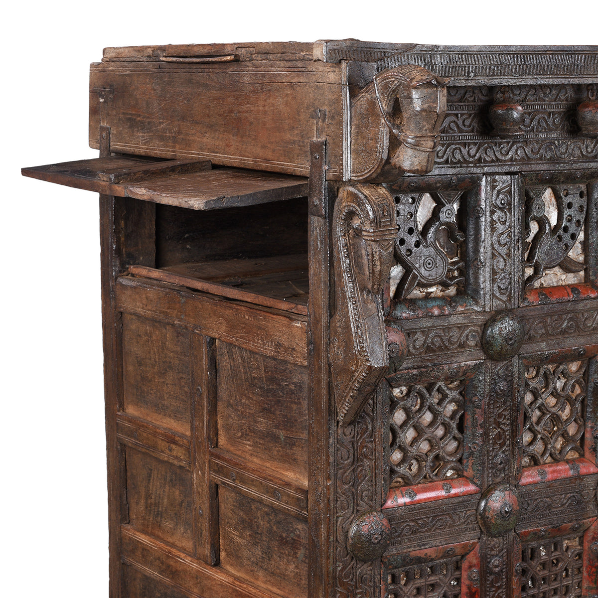 Side Hidden Compartment Detail From Antique 19th-century Indian dowry chest from Gujarat with intricate animal carvings, geometric patterns, and hidden compartments, set on wheels.