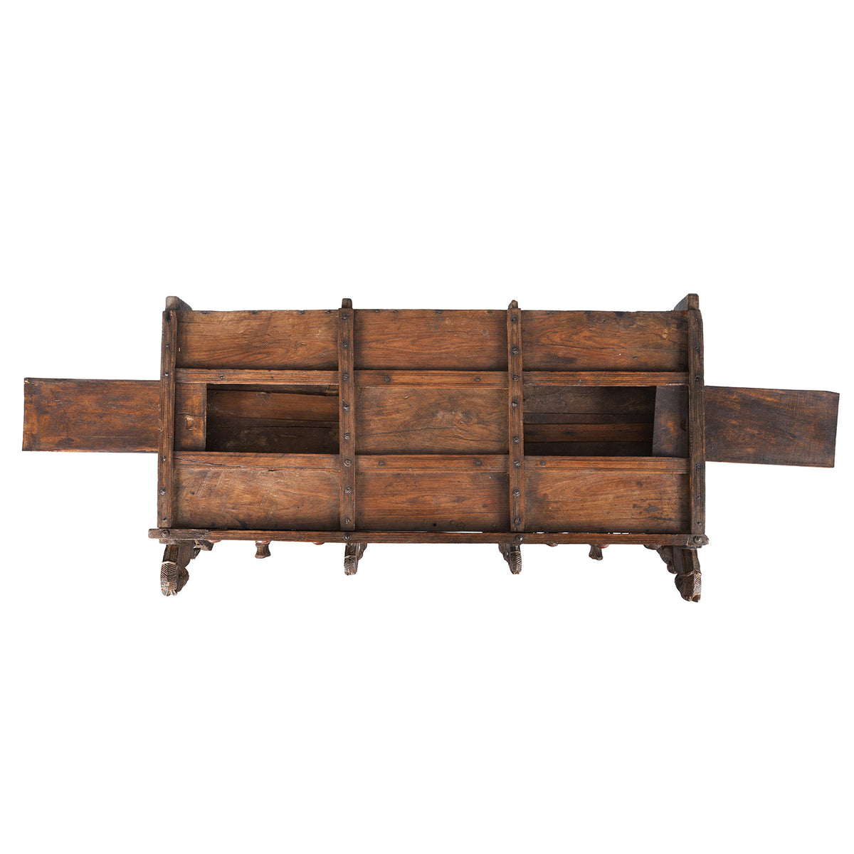 Secret Compartment Detail From Antique 19th-century Indian dowry chest from Gujarat with intricate animal carvings, geometric patterns, and hidden compartments, set on wheels.