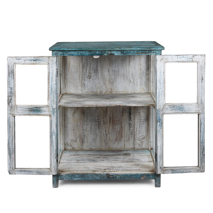 Interior Of Elegant Glazed Display Cabinet From 19th Century Gujarat With Distressed Blue Exterior And White Interior, Featuring Shelf For Generous Storage