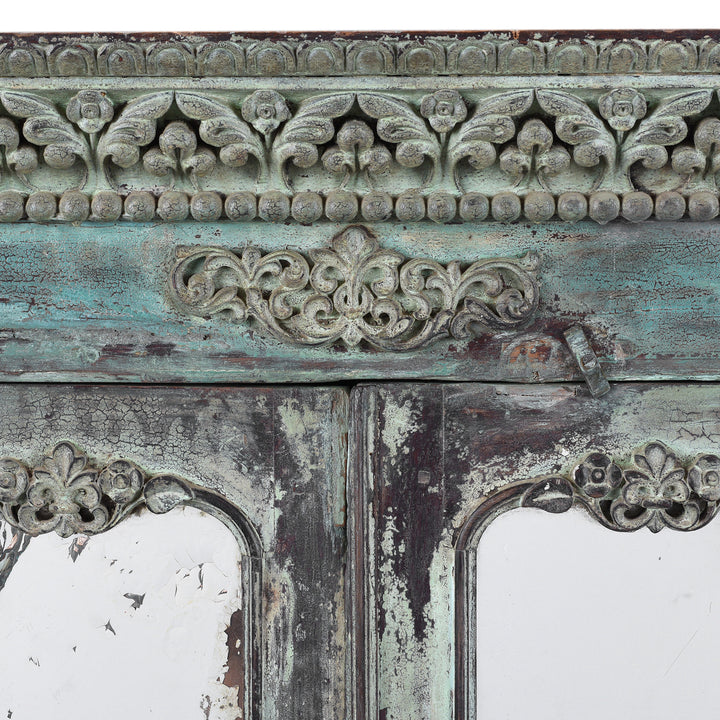 Central Carving Detail From Green Painted Sunburst Almirah Cabinet With Carved Teak Panels And Distressed Lime Washed Finish