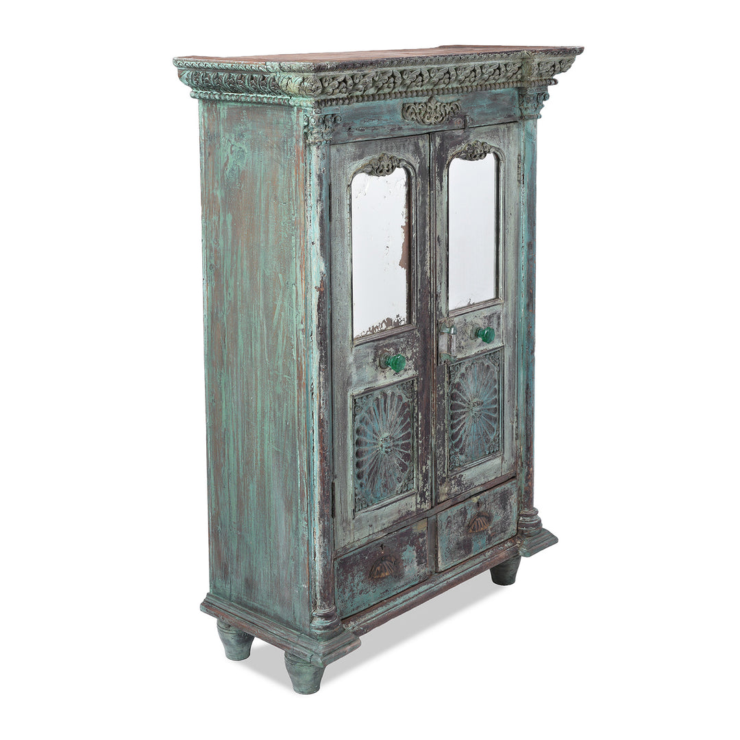 Angled VIew Of Green Painted Sunburst Almirah Cabinet With Carved Teak Panels And Distressed Lime Washed Finish