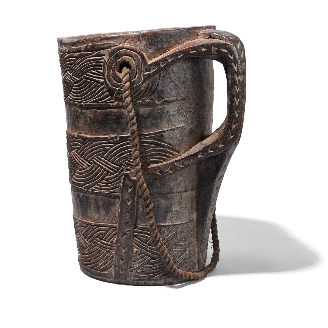Rear View Of Nepalese Carved Wooden Milk Jar With Geometric Banding Rope Strap And Integrated Handle Early 20th Century