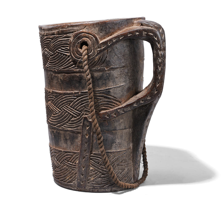 Rear View Of Nepalese Carved Wooden Milk Jar With Geometric Banding Rope Strap And Integrated Handle Early 20th Century