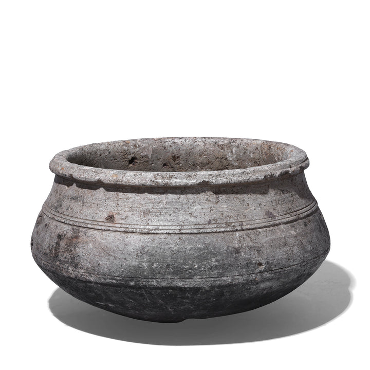 Indian Nineteenth Century Hand Carved Stone Water Pot With Carved Grooves And Aged Surface Used As A Planter
