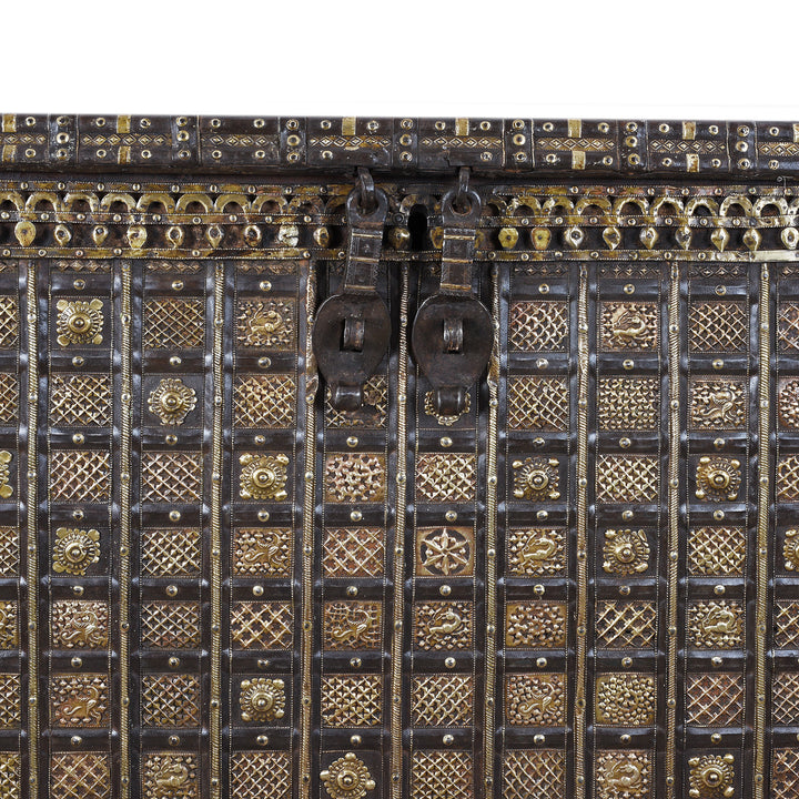 Latch Detail From Antique 18th Century Iron Bound Teak Pithara Dowry Chest With Brass Studs Carved Animal Motifs And Interior Chains Adapted As Console Table