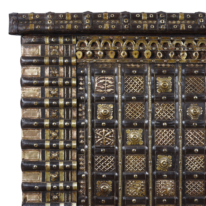 Corner Detail Showing Brasswork On Antique 18th Century Iron Bound Teak Pithara Dowry Chest With Brass Studs Carved Animal Motifs And Interior Chains Adapted As Console Table