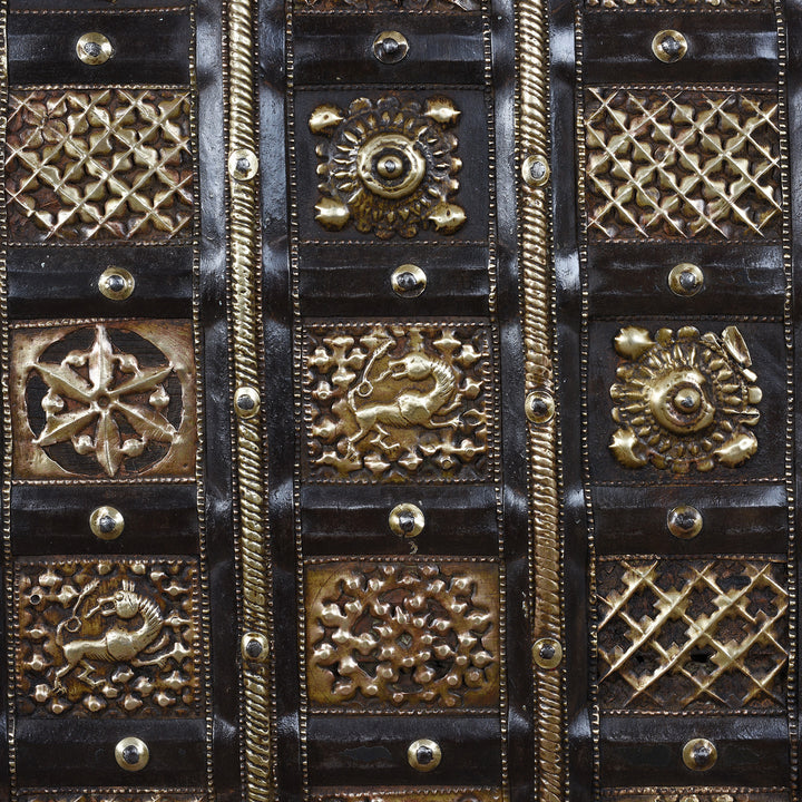 Brasswork Detail From Antique 18th Century Iron Bound Teak Pithara Dowry Chest With Brass Studs Carved Animal Motifs And Interior Chains Adapted As Console Table