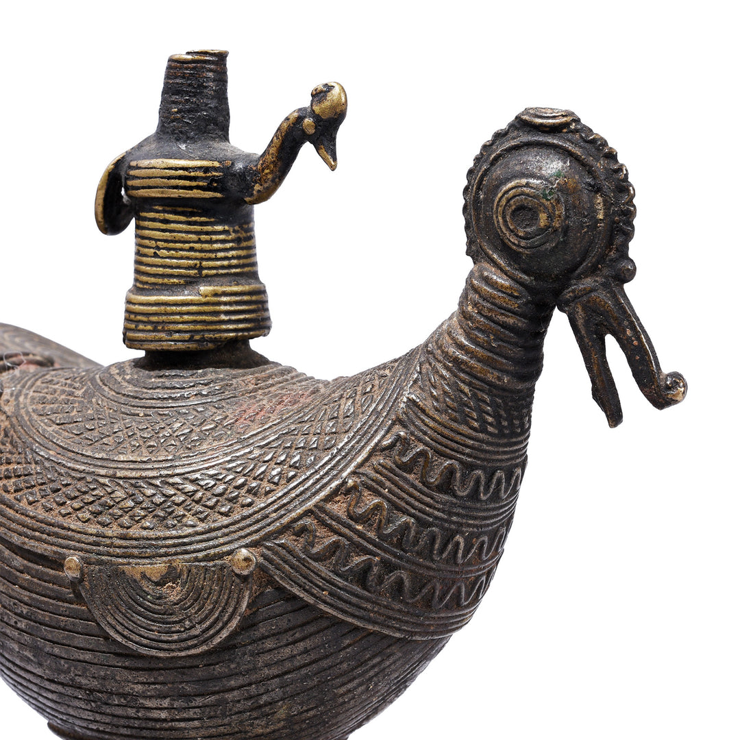 Face Detail From Brass Dhokra Peacock Oil Lamp From Orissa With Geometric Detailing And Aged Patina Circa 1920