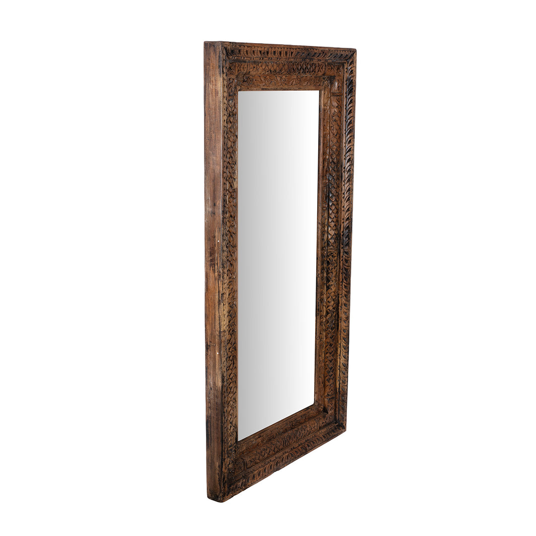 Angled VIew Of Carved Mirror Made From Reclaimed Teak Wood With Floral Detailing From Gujarat