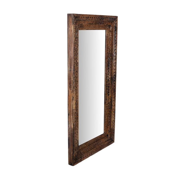 Angled VIew Of Carved Mirror Made From Reclaimed Teak Wood With Floral Detailing From Gujarat
