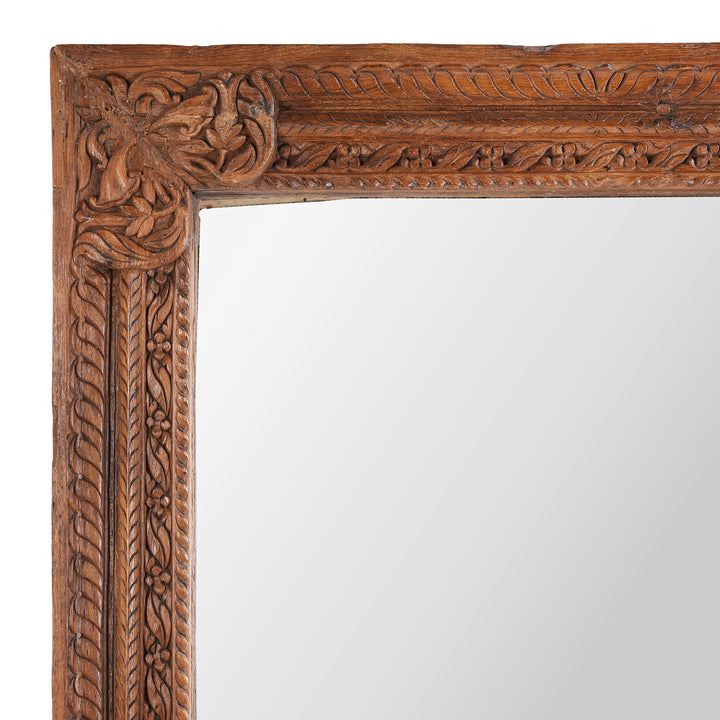 Corner Detail Showing Carvings From 19th-Century South Indian Teak Mirror With Intricate Botanical Carvings And Temple-Inspired Details.
