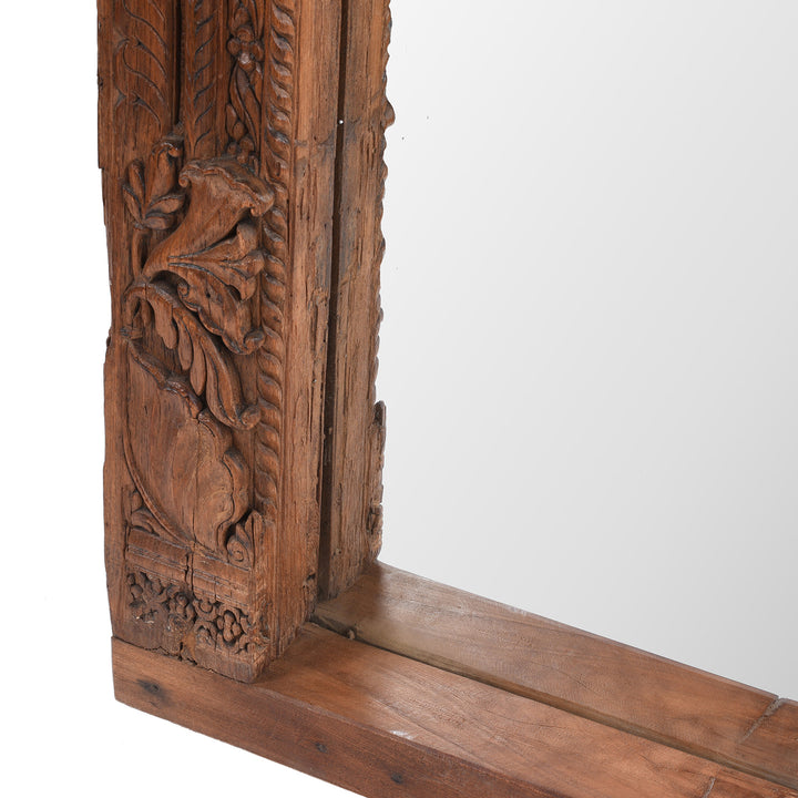 Bottom Corner Carving And Frame Depth Detail From 19th-Century South Indian Teak Mirror With Intricate Botanical Carvings And Temple-Inspired Details.
