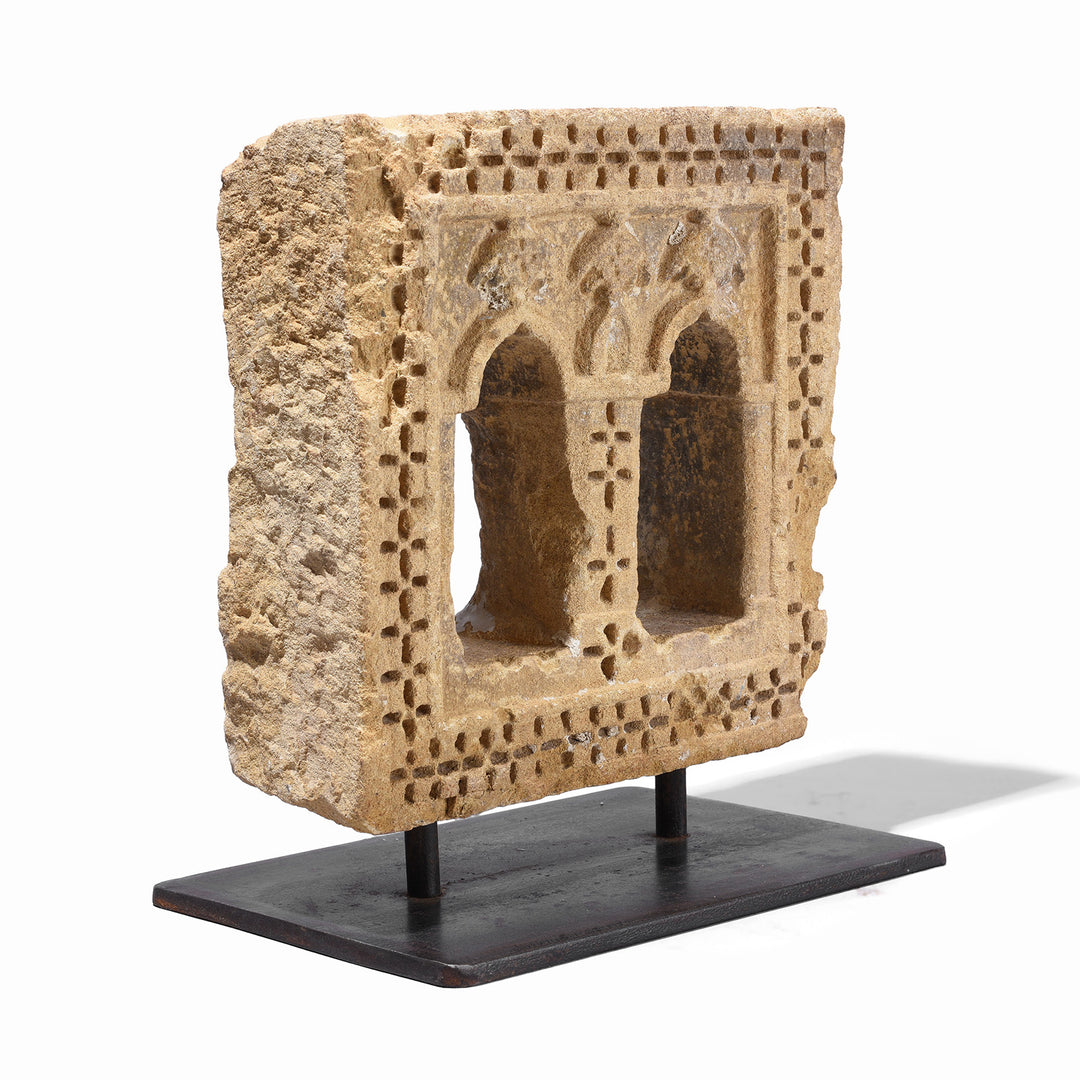 Angled VIew Of Antique 19th Century Jaisalmer Yellow Sandstone Twin Arched Lamp Niche Mounted On Stand With Hand Carved Geometric Detailing | Indigo Antiques