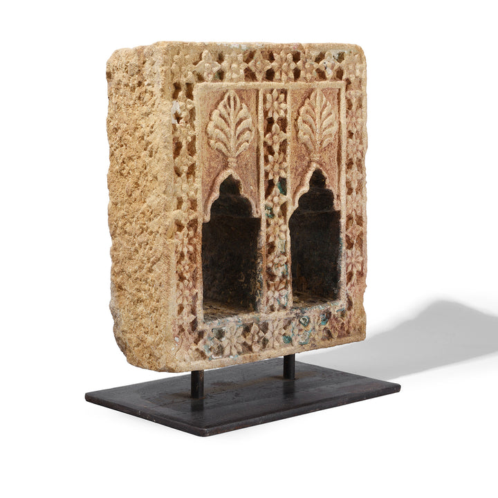 Angled View Of Antique Hand Carved Yellow Sandstone Lamp Niche From Jaisalmer Rajasthan With Floral Detailing Mounted On Iron Stand