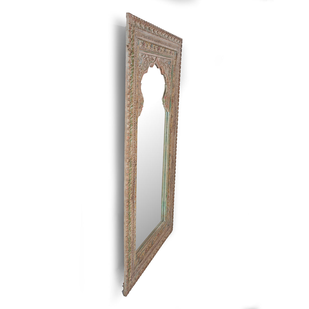 Angled View Of Hand Carved Indian Mango Wood Mihrab Mirror With Painted Floral Detailing